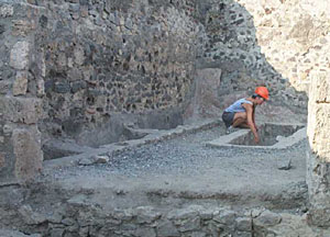 " Amy McCabe (Indiana University) investigates one of the tanks at the back of the so-called soap factory. The function of this industrial space in its final phase remains unclear." Via Interactive Archaeology